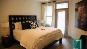 Bedroom at The Monterey by Windsor Apartments in Uptown Dallas TX Lux Locators Dallas Apartment Locators